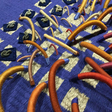 Load image into Gallery viewer, textile fiber relief sculpture detail 2, vibrant playful colors on a blue background