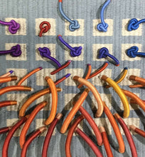Load image into Gallery viewer, textile relief sculpture detail 2, vibrant playful colors on a muted blue background