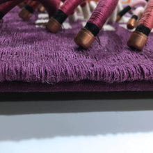Load image into Gallery viewer, woven textile relief sculpture detail 4, playful colors on a dark wine background