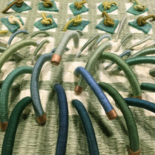 Load image into Gallery viewer, textile fiber relief sculpture detail 2, green blue yellow and cream colors, visually exciting
