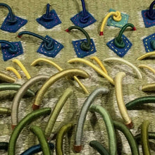 Load image into Gallery viewer, Woven textile relief sculpture detail 2, nature inspired greens and accented with greens, blues, yellows and flecks of red
