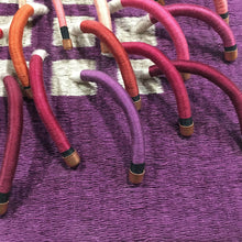 Load image into Gallery viewer, woven textile relief sculpture detail 2, playful colors on a dark wine background
