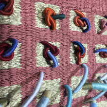 Load image into Gallery viewer, woven textile relief sculpture detail 4, vibrant playful blue and red colors on a dusty rose background
