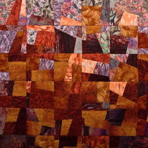 Vibrant Red Art Quilt, detail 1, Displaying Organized Chaos in colors of reds, pinks, oranges and purples