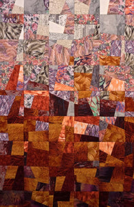 Vibrant Red Art Quilt, detail 2, Displaying Organized Chaos in colors of reds, pinks, oranges and purples